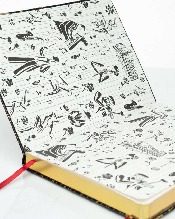 This is an image of the inside front cover of the Harlem, renaissance, inspired, black and gold journal.