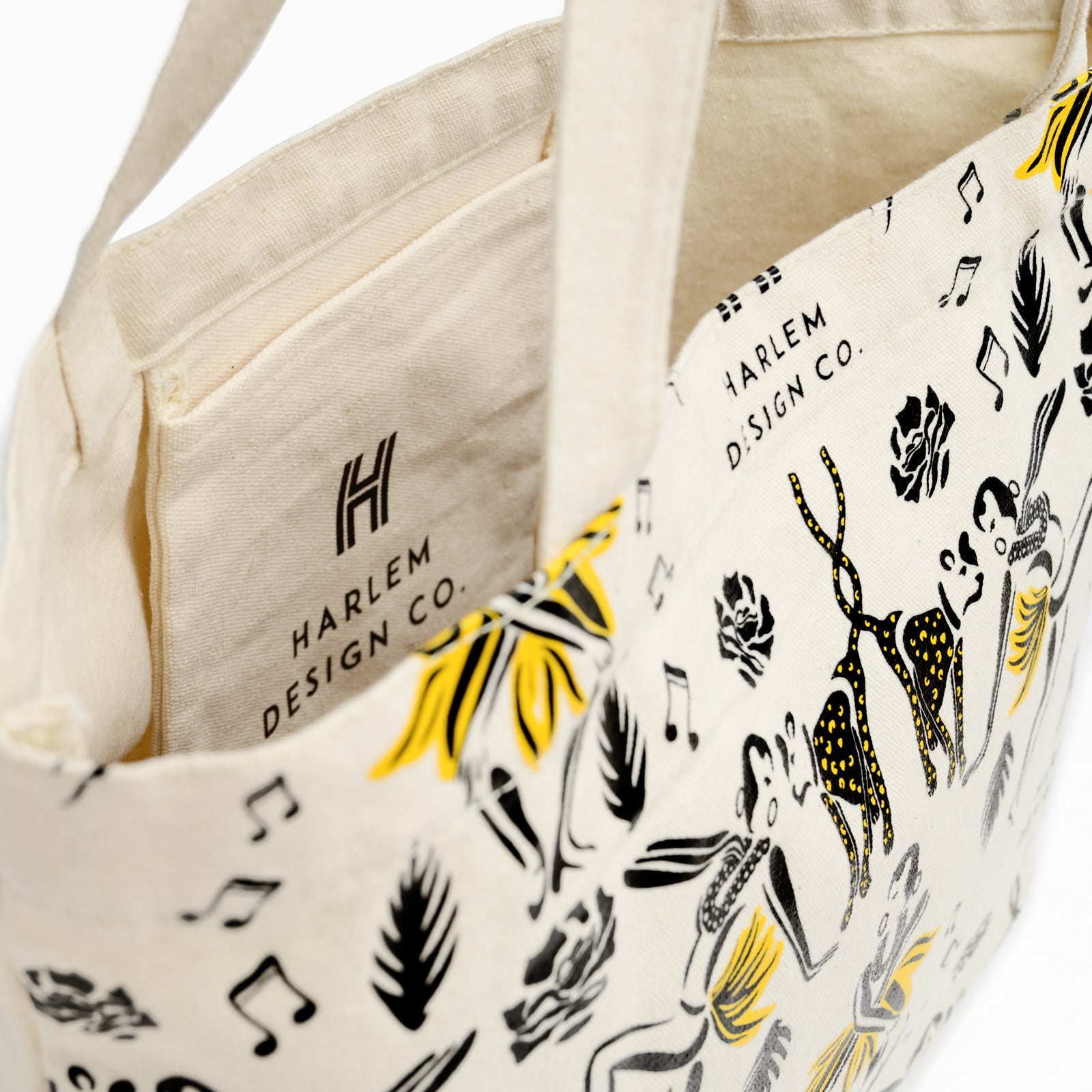 Inside view of canvas tote bag with Harlem Design illistrations of Josephine Baker and her cheetah.