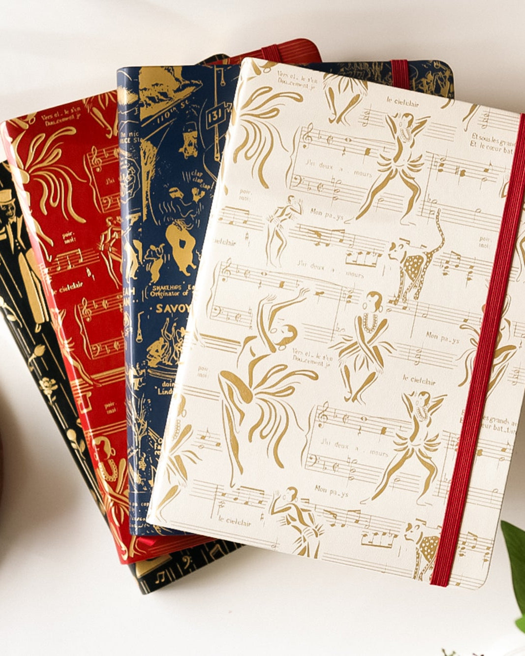 Image of four Harlem Renaissance inspired journals.