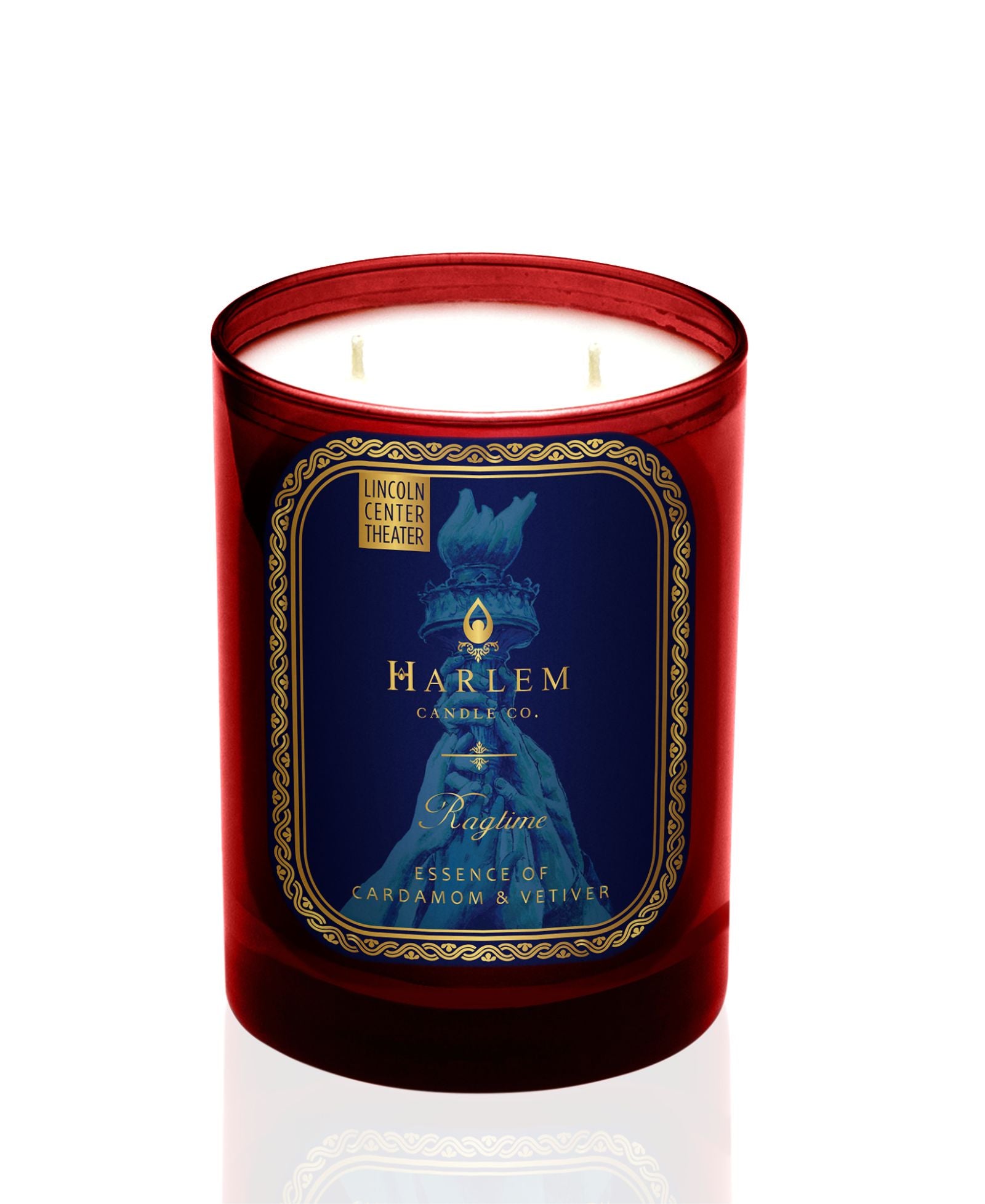 Harlem Candle Co. Ragtime candle with a blue label in a red glass on a white background