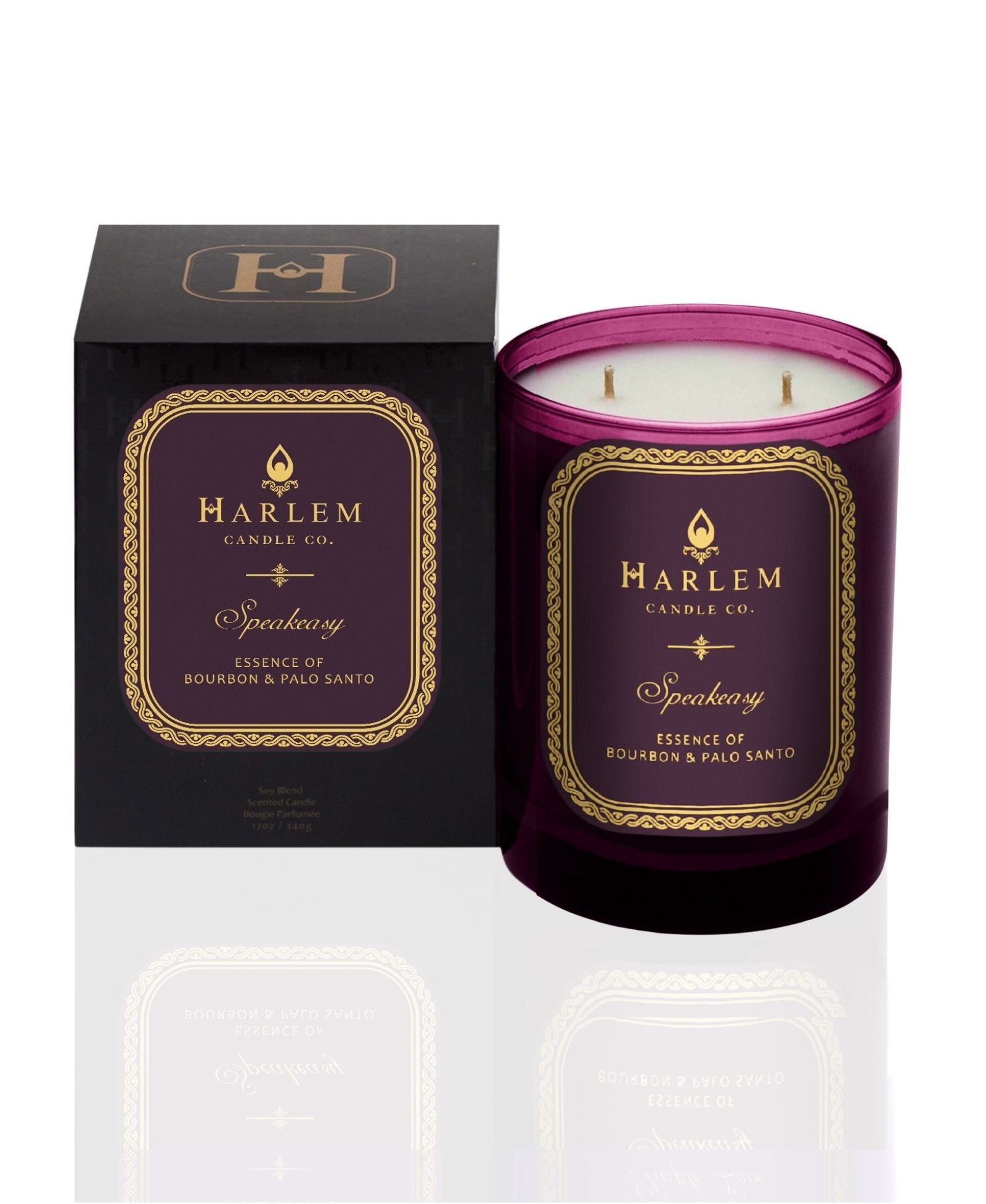 Burgundy 11 oz Speakeasy candle with gold and burgundy label/. This candle has 2 wicks. It is pictured next to it's decorative candle box.