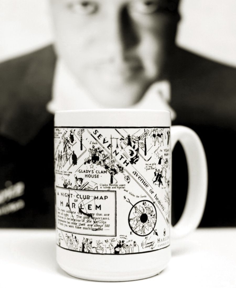 White mug with black and white design of a map and text, image of Duke Ellington in background.