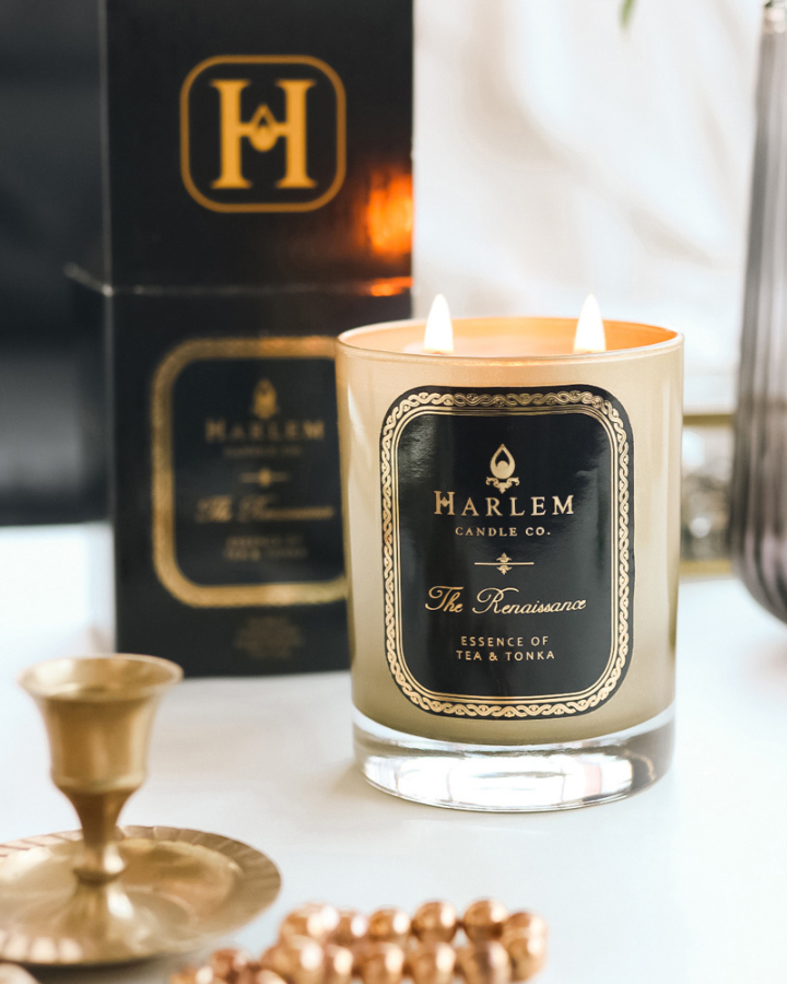 This is an image of our 2 wick Renaissance candle pictured next to its decorative box in a lifestyle setting.