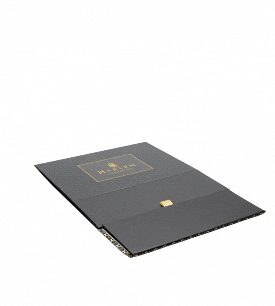This is a moving image that shows how the fully collapsable black and gold Harlem Candle Co gift box is assembled. This should be purchased with at least 2 to 3 11 oz candles.